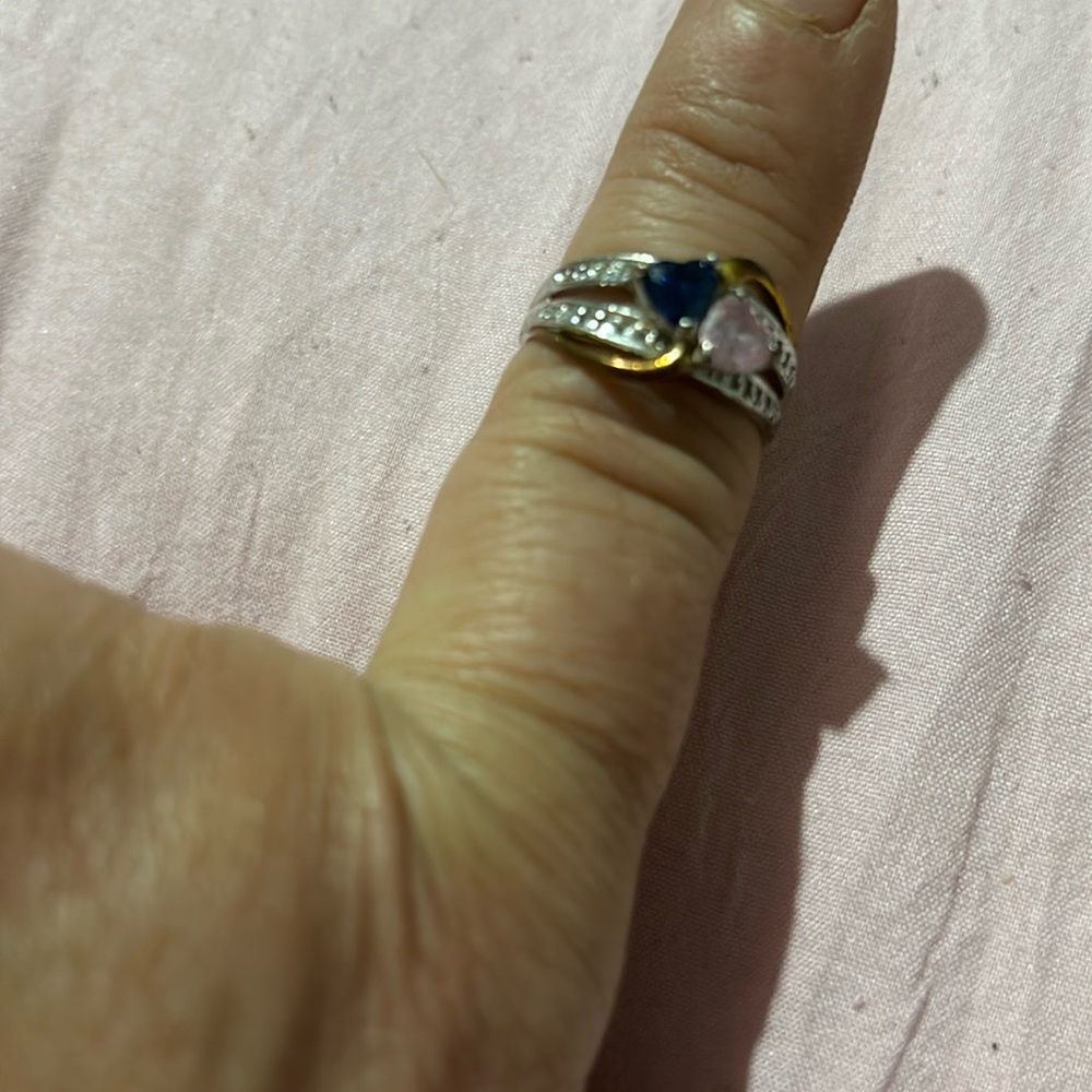 Pin and blue stone ring